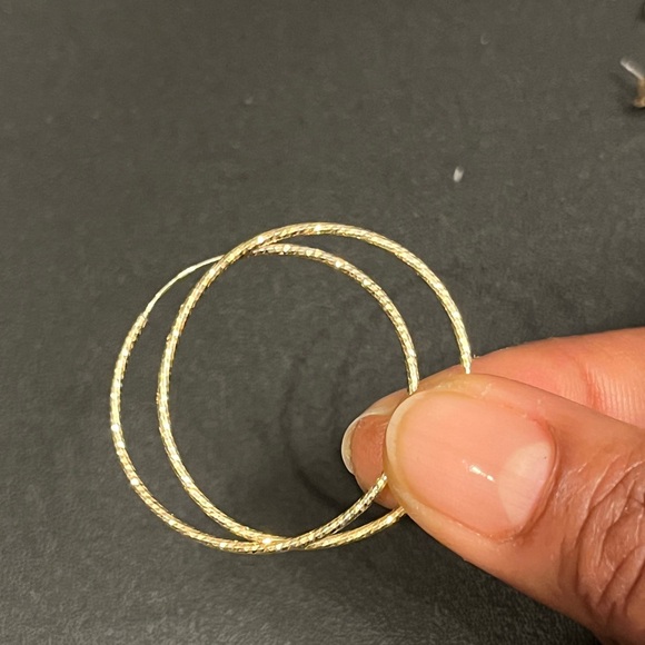 Three pair of gold tone hoop earrings - Picture 3 of 4